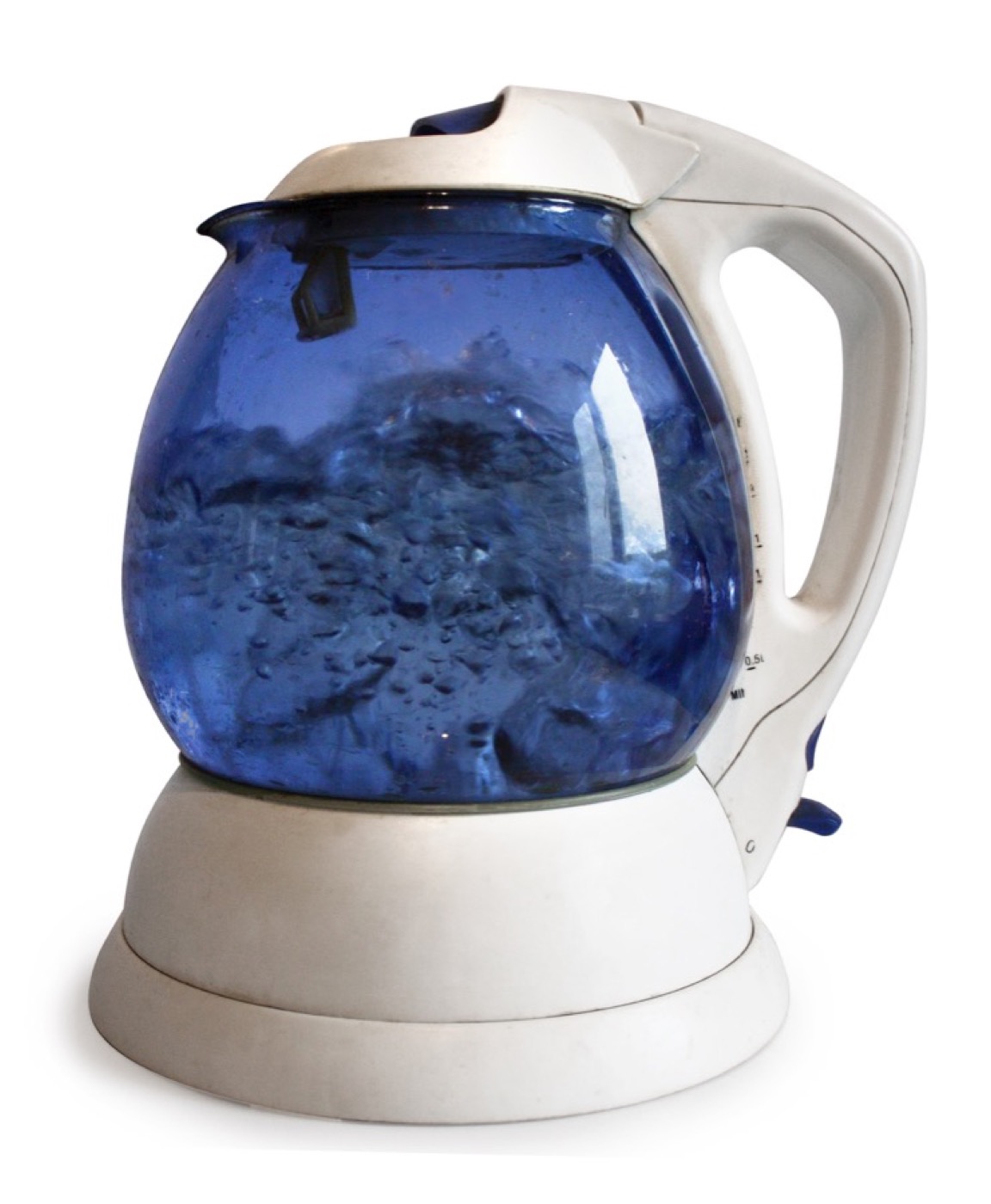 Clear drinking water being heated in a glass kettle